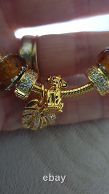 GENUINE PANDORA BRACELET Gold + 6 PANDORA LION KING. CHARMS 20 cm ALE MET RP £500