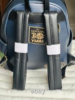Sac Loungefly Disney Le Roi Lion 30e anniversaire Simba, Timon et Pumbaa GITD