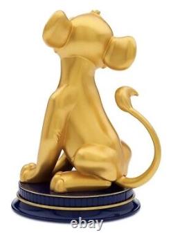 Traduisez ce titre en français : Disney 50e anniversaire Fab 50 SIMBA LE ROI LION STATUE EN RÉSINE DORÉE 8.5 NIB